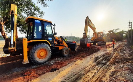 A selection of heavy machinery available for equipment rental in Bangladesh, including tower cranes, bulldozers, and telehandlers.